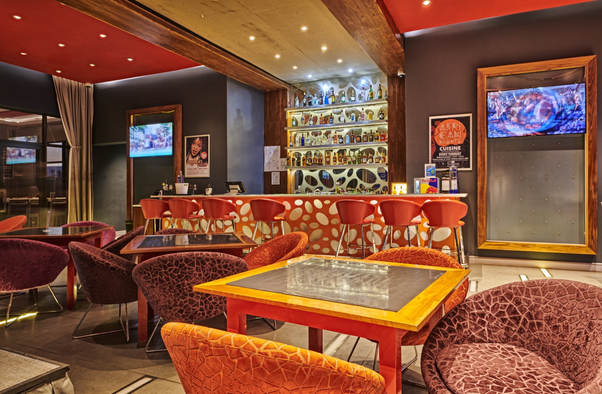 Molecule Showbar with plush red seating and bar stools at Thaba Moshate, Burgersfort
